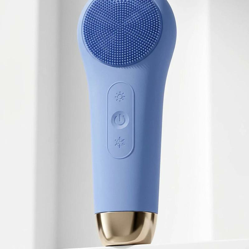 The Borcomni listing photo: the blue electric facial brush with a gold base.
