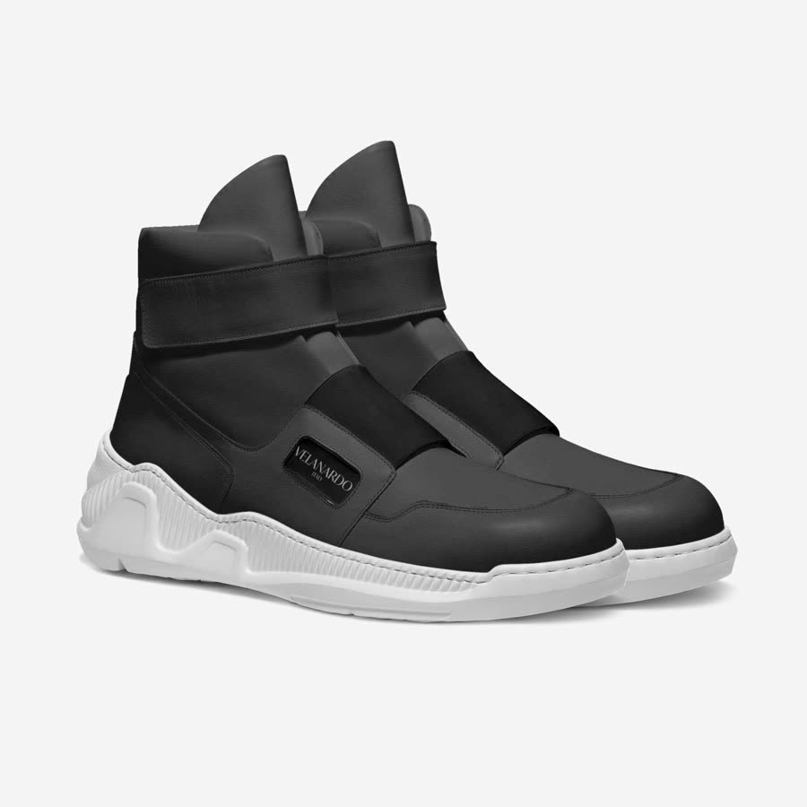 The Velanardo listing photo: the black Ehi Amico boots at a three-quarter angle on a white ground.